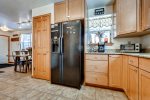 Kitchen with standard 12 cup coffee maker, toaster oven, and microwave 